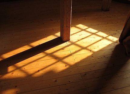 Warm sunlight on a floor.